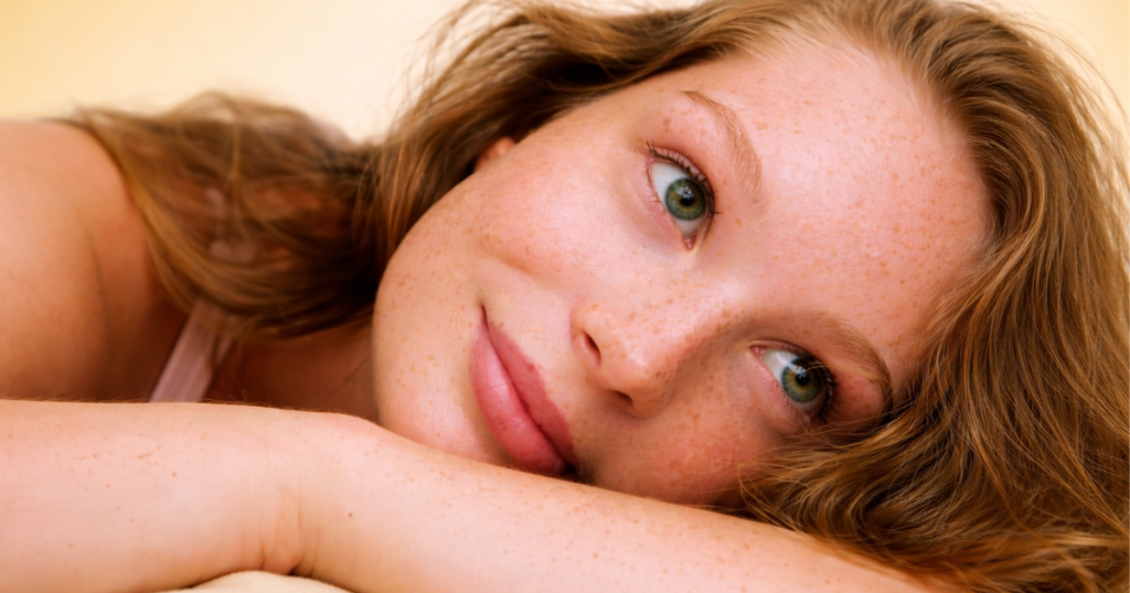 Woman resting with long hair.